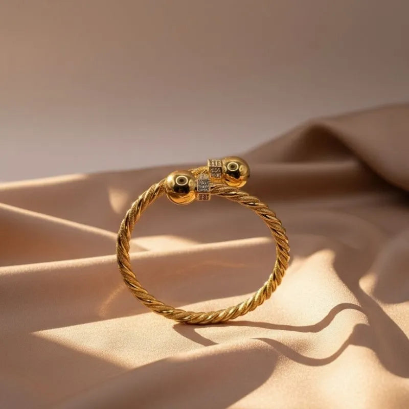 21k gold-plated twisted cable cuff bracelet with zirconia balls