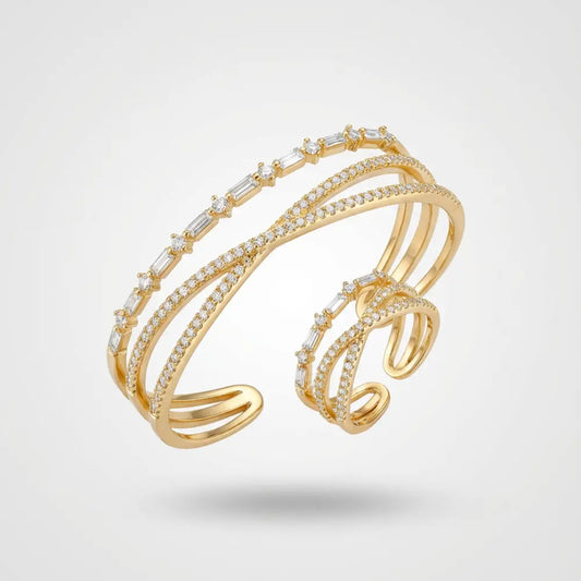 Gold Plated Criss-Cross Baguette Bracelet and Ring Set on a light gray background