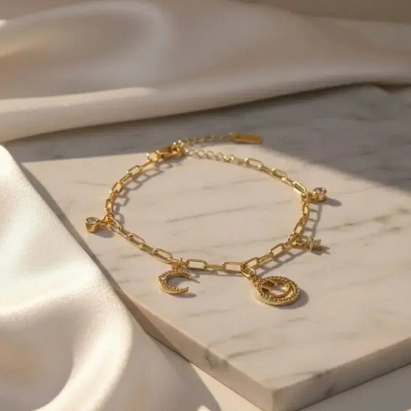gold-plated non-tarnish star and moon charm bracelet Close details