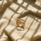 Gold-toned adjustable ring with cubic zirconia accents