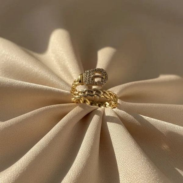 Gold-toned adjustable ring with cubic zirconia accents close detail