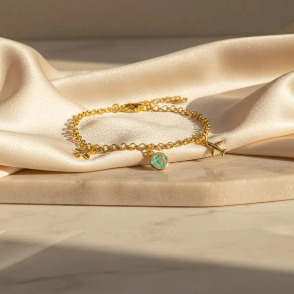 Gold-Plated Charm Bracelet with Travel-Themed Charms