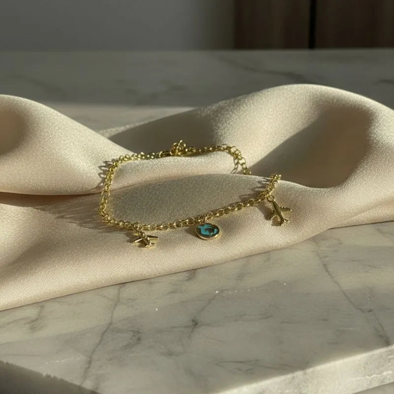 Gold-Plated Charm Bracelet with Travel-Themed Charms