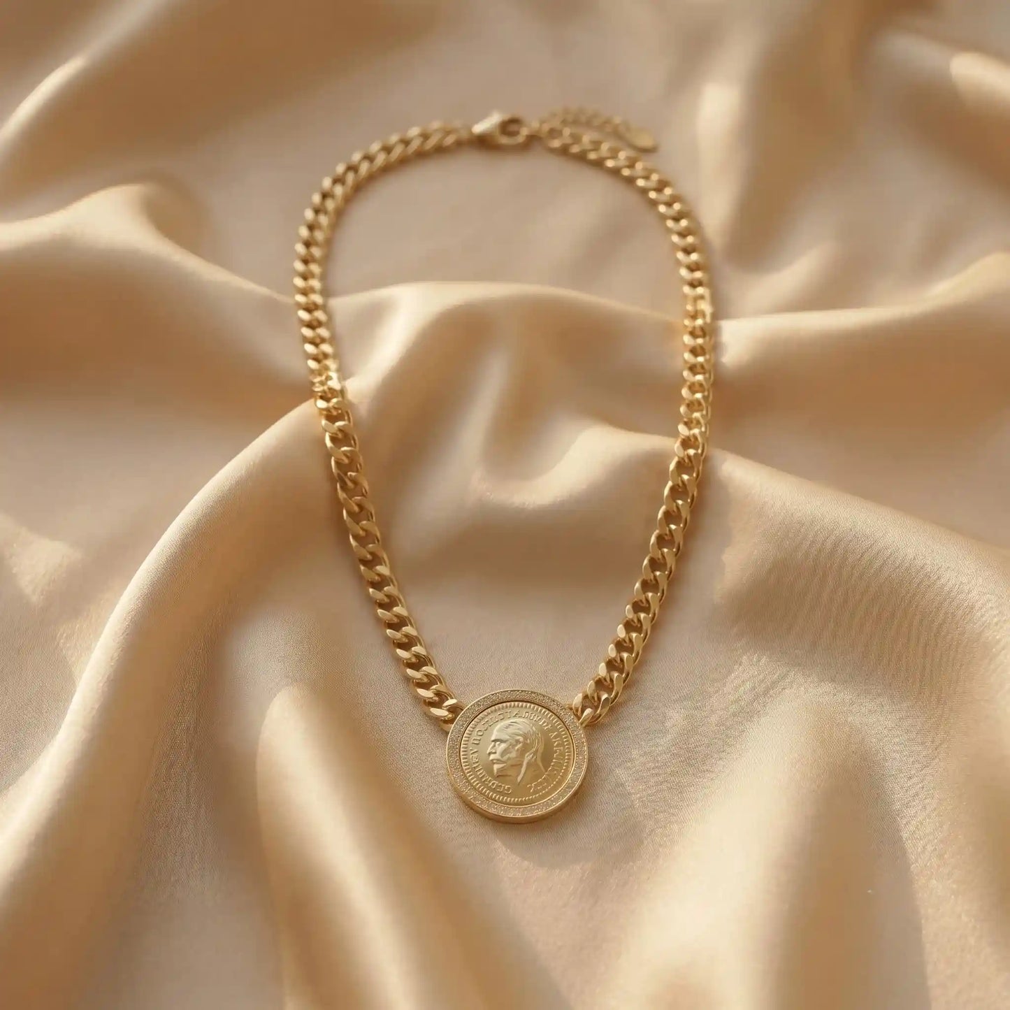Gold plated statement necklace featuring a thick curb chain and a vintage engraved coin medallion framed with zircon crystals from Bellora Bloom.