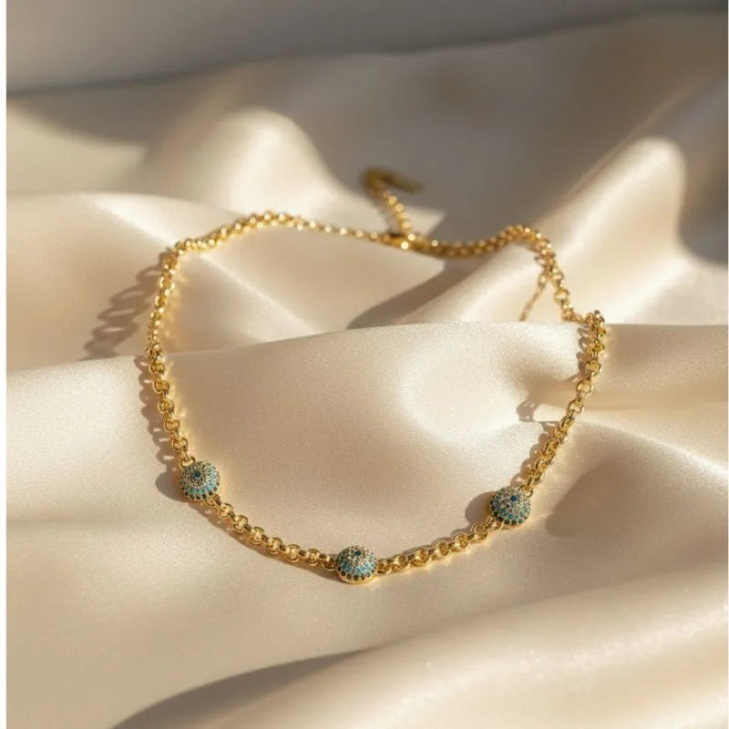 Gold-plated chain necklace with three turquoise evil eye charms