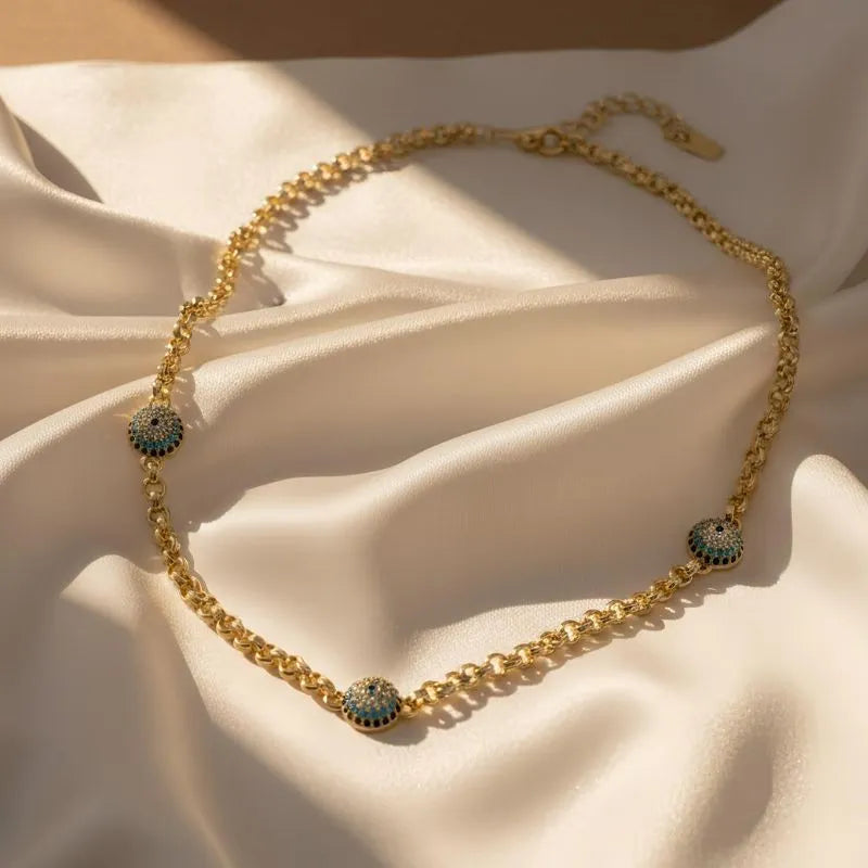 Gold-plated chain necklace with three turquoise evil eye charms