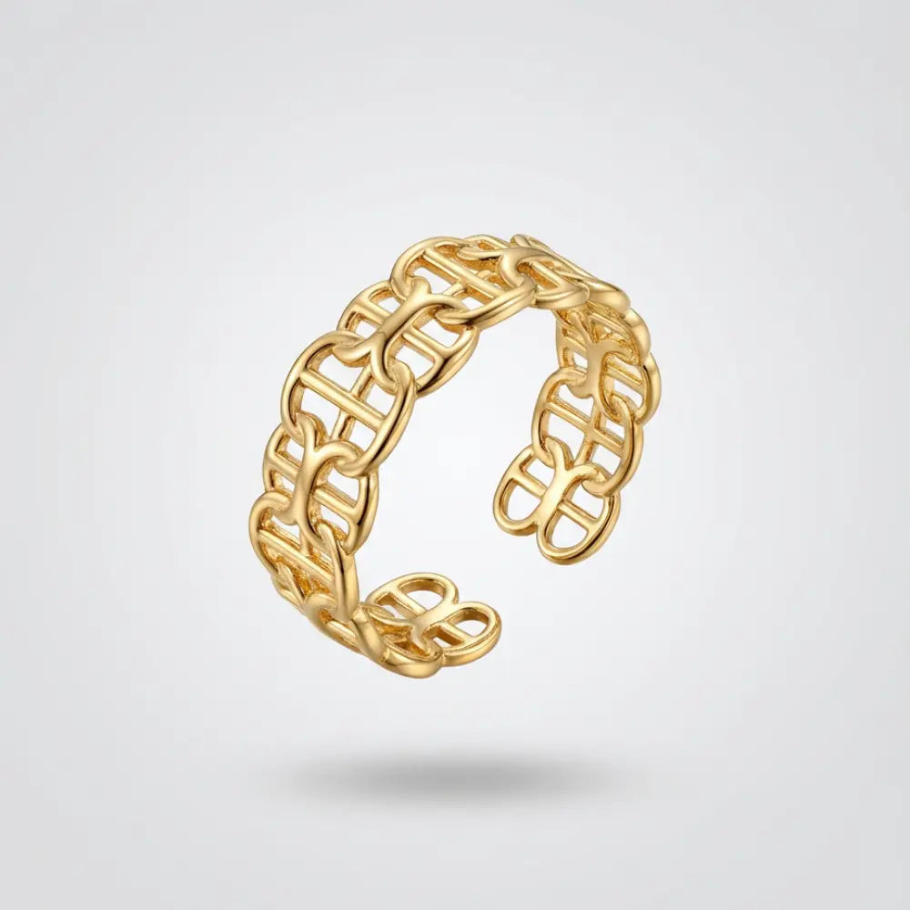 Gold chain-style ring on a light gray background