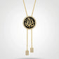 Gold necklace with a black pendant featuring Arabic calligraphy on a white background