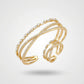 Gold Plated Criss-Cross Baguette Bracelet and Ring Set on a light gray background
