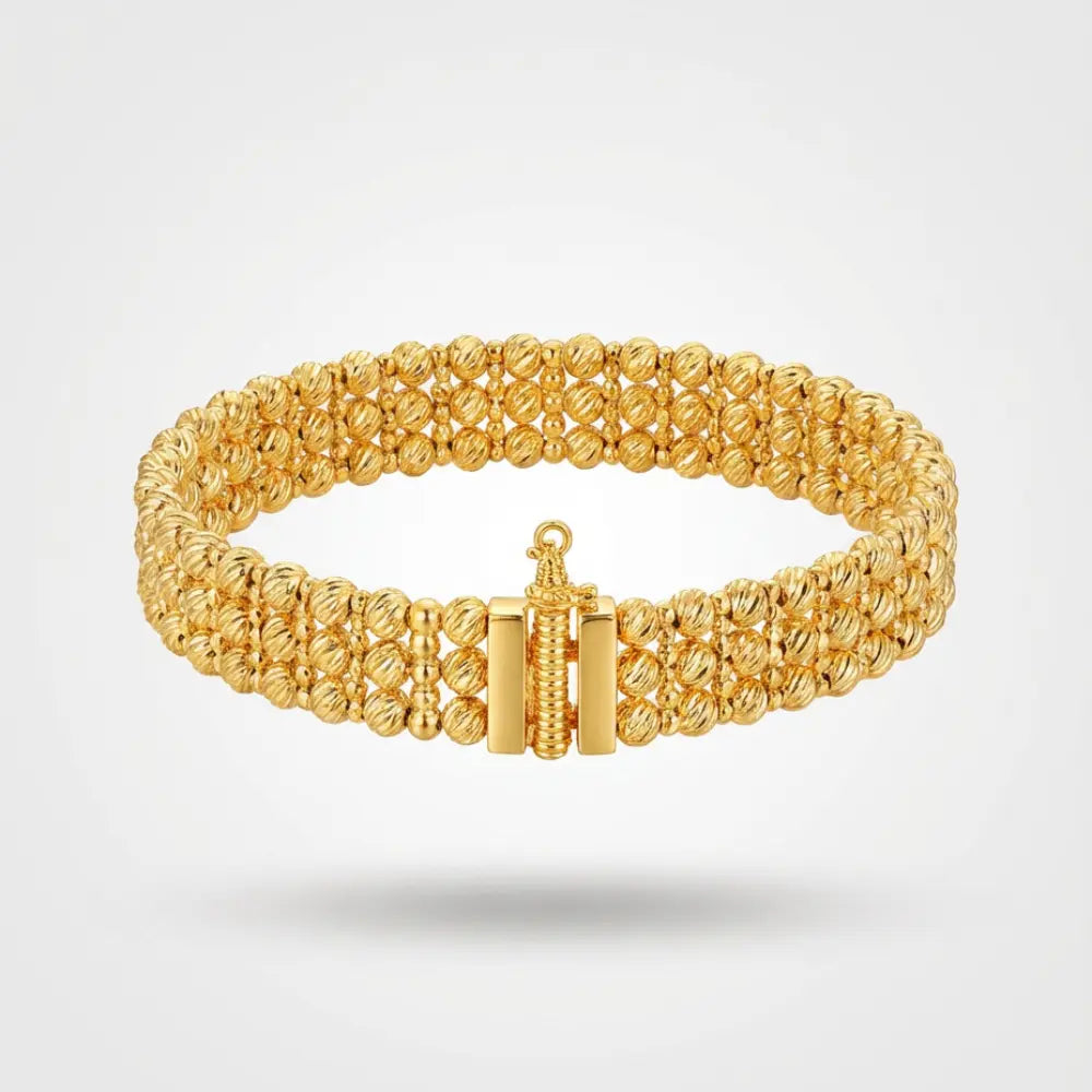 Gold Plated Ribbed Bead Bracelet on a light gray background