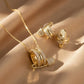 Gold Plated Safety Pin Zirconia Set featuring necklace and rings