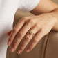 Hand wearing a Gold Plated Ring for Ladies with Crossed Sparkling Design