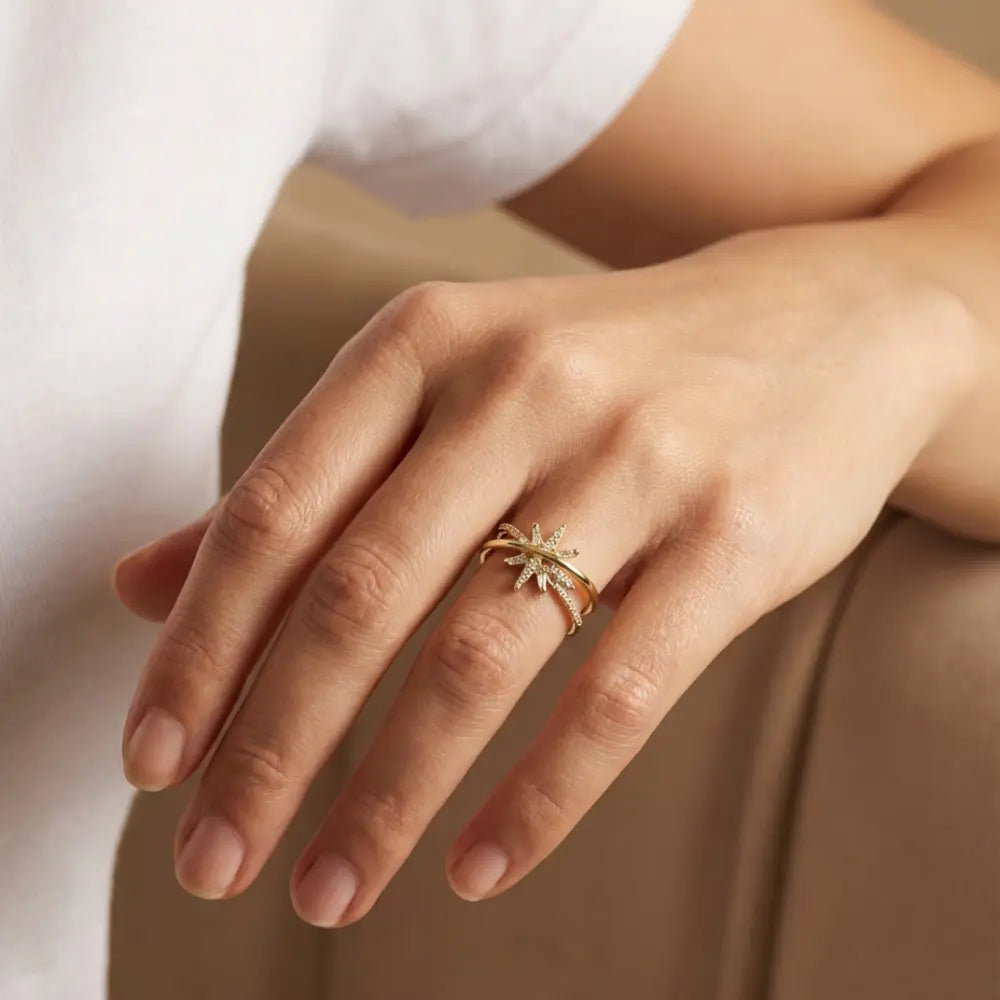 Hand wearing a Gold Plated Ring for Ladies with Crossed Sparkling Design