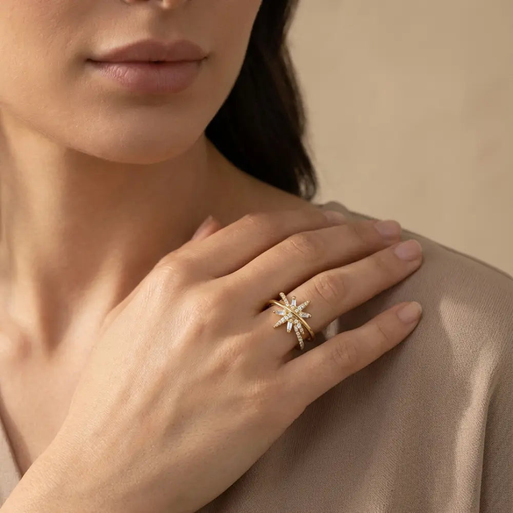 Close-up of a hand wearing Gold Plated Ring for Ladies with Crossed Sparkling Design