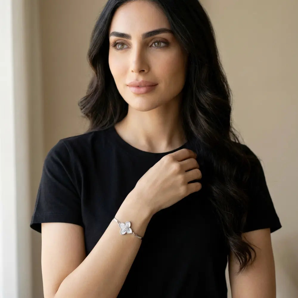 Woman wearing a Silver Mother of Pearl Clover Flower Bangle