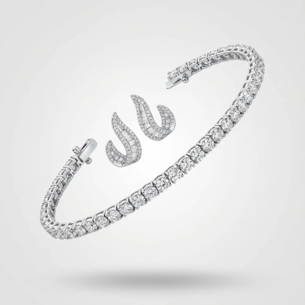 Silver tennis bracelet and curved stud earrings with baguette-cut diamonds on a neutral background.