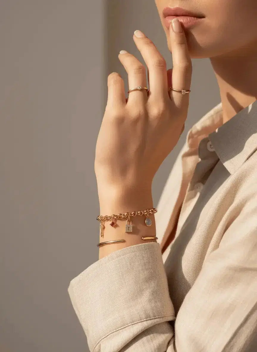 Stunning gold-plated bracelet with a lock, key, and crystal design