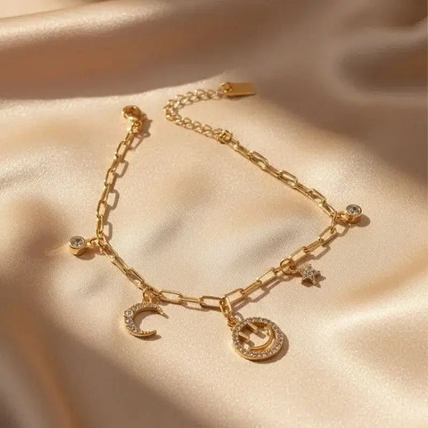 gold-plated non-tarnish star and moon charm bracelet