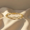 gold-tone chain link bracelet with pavé crystal accents
