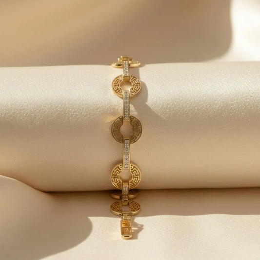 gold-toned bracelet with a Greek key pattern  and crystal accents