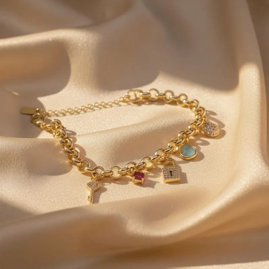 Stunning gold-plated bracelet with a lock, key, and crystal design