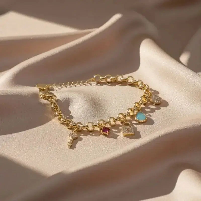 Stunning gold-plated bracelet with a lock, key, and crystal design