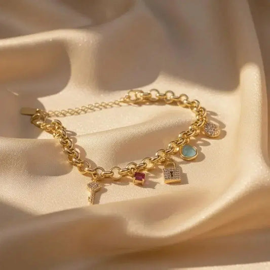 Stunning gold-plated bracelet with a lock, key, and crystal design